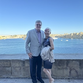 Couple overlooking Malta’s Grand Harbour during a custom luxury vacation